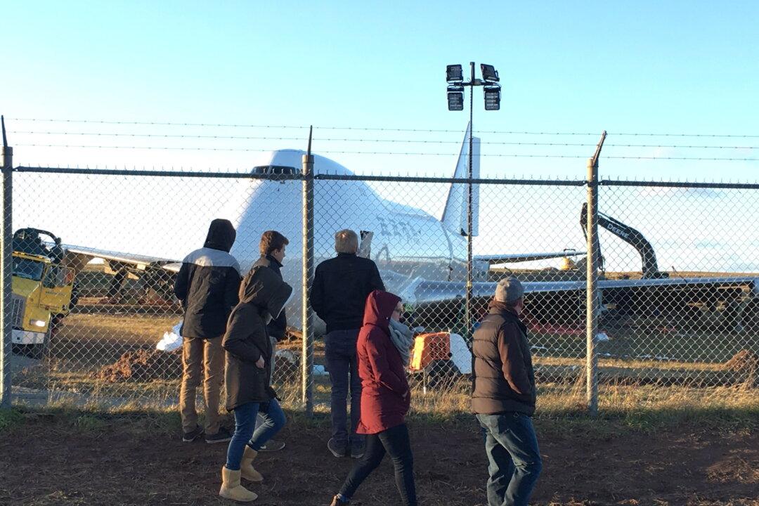 Crowd Watches as Backhoe Rips Into Mangled Plane After Halifax Runway Overrun