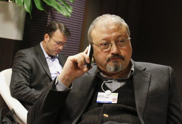File photo of Saudi dissident and journalist Jamal Khashoggi speaking on his cellphone at the World Economic Forum in Davos, Switzerland, Jan. 29, 2011. (AP Photo/Virginia Mayo)