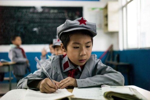 Students study in their classroom at the Yang Dezhi elementary school in Wenshui, Xishui country in southwestern China's Guizhou province, on Nov. 7, 2016. In 2008, Yang Dezhi was designated a "Red Army primary school." Such schools are an extreme example of the "patriotic education," which China's ruling Communist Party promotes. (Fred Dufour/AFP/Getty Images)