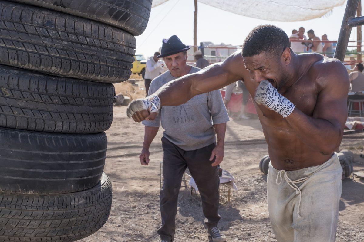 Rocky Balboa (Sylvester Stallone, L) and Adonis Creed (Michael B. Jordan) in “Creed II.” (Barry Wetcher/Metro Goldwyn Mayer Pictures/Warner Bros. Pictures)