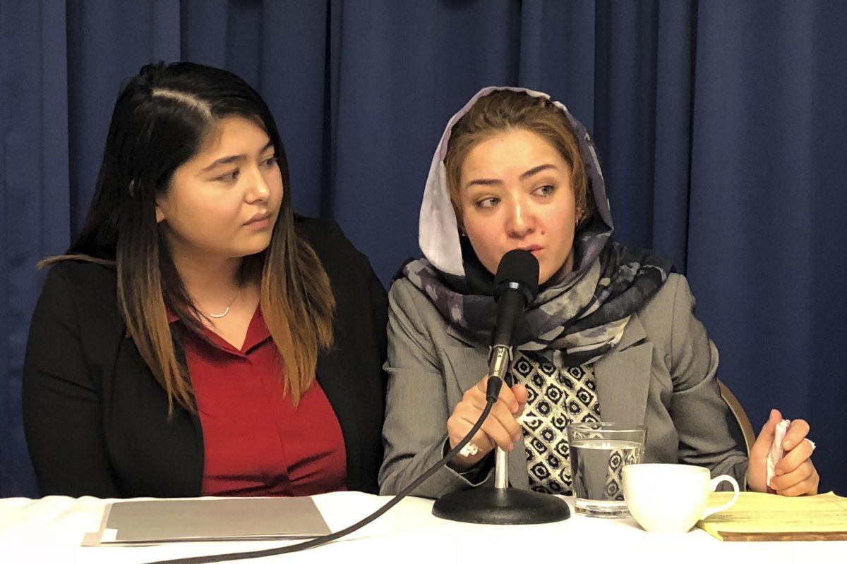 Mihrigul Tursun (R), a member of China’s Uyghur minority, details the torture and abuse she suffered at the hands of the Chinese regime, at the National Press Club in Washington on Nov. 26, 2018. (Maria Danilova/AP)