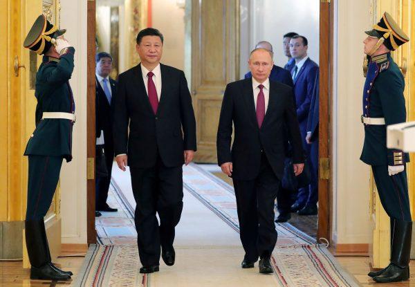 Russian President Vladimir Putin (2nd R) and Chinese leader Xi Jinping (2nd L) at the Kremlin in Moscow on July 4, 2017. (Mikhail Klimentiev/AFP/Getty Images)<span style="font-size: 16px;"> </span>