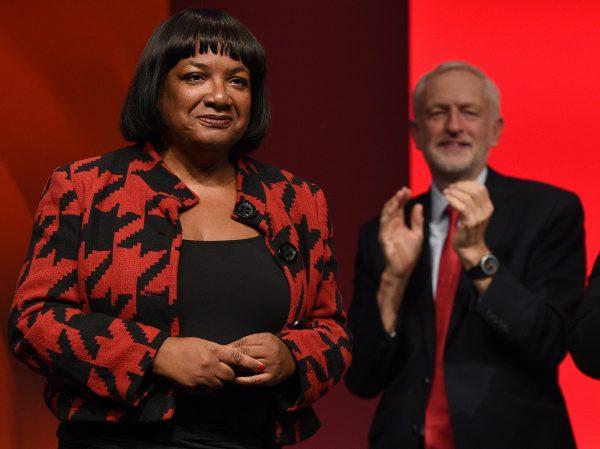 Former Labour Party leader Jeremy Corbyn (R) applauds former shadow home secretary Diane Abbott (L) after she addressed delegates on the third day of the Labour party conference in Liverpool, England, on Sept. 25, 2018. (Oli Scarff/AFP/Getty Images)