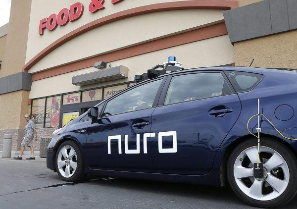 A self-driving Nuro vehicle is parked outside a supermarket as part of a pilot program using driverless cars to deliver groceries, in Scottsdale, Arizona, on Aug. 16, 2018. (Ross D. Franklin/AP)
