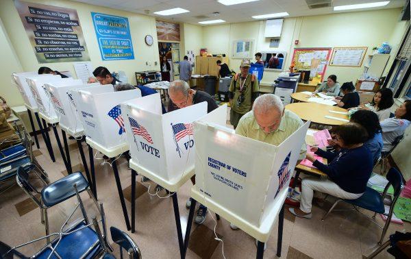 People cast their ballots in voting booths at the 2nd Street Elementary School in the Boyle Heights neighborhood of Los Angeles, California on November 6, 2018 as Americans across the country cast their votes for the mid-term elections. (Frederic Brown/AFP/Getty Images)