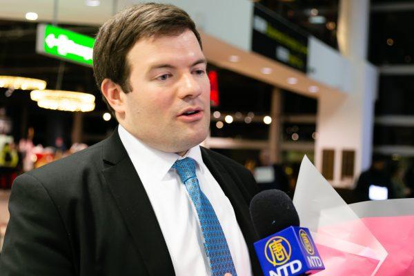 Trumpet player Eric Robins at London's Gatwick airport on Jan. 6. (Roger Luo/NTD Television)