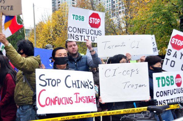 People demonstrate against the Toronto District School Board's partnership with the Beijing-controlled Confucius Institute outside the TDSB on Oct. 29, 2014. (Allen Zhou/The Epoch Times)