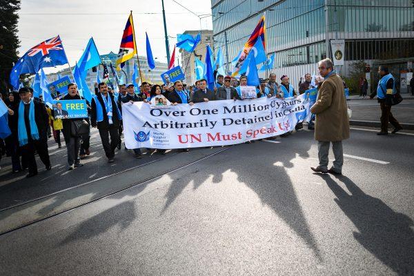 Uyghurs and Tibetan people demonstrate against China outside of the United Nations (UN) offices during the Universal Periodic Review of China by the UN Human Rights Council in Geneva on Nov. 6, 2018. (Fabrice Coffrini/AFP/Getty Images)