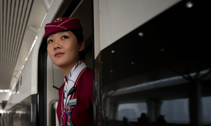 Railroad Engineer Proposes to Railroad Attendant at Station Stop