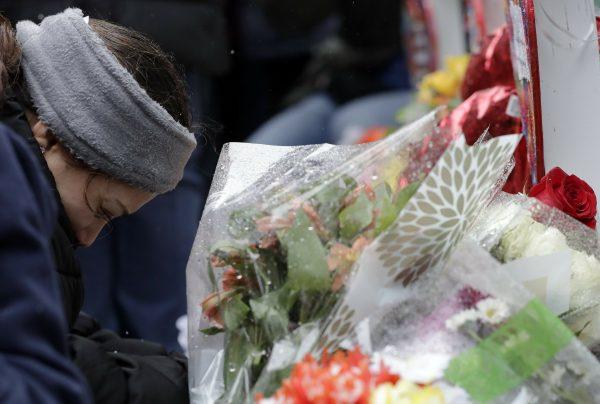 One of victim Vicente Juarez's daughter Diana Juarez cries at a makeshift memoria in Aurora, Ill., on Feb. 17, 2019. (Nam Y. Huh/AP)