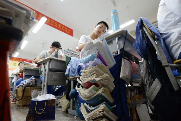 High school students go through exam papers ahead of the annual "Gaokao," or college entrance examinations, in Handan City, Hebei Province, China, on May 23, 2018. (AFP/Getty Images)