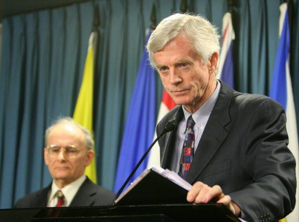 Former Canadian Secretary of State for Asia-Pacific David Kilgour (R) presents a revised report about the continued murder of Falun Gong practitioners in China for their organs. Report co-author and lawyer David Matas listens in the background, Jan. 31, 2007. (Matt Hildebrand/The Epoch Times)