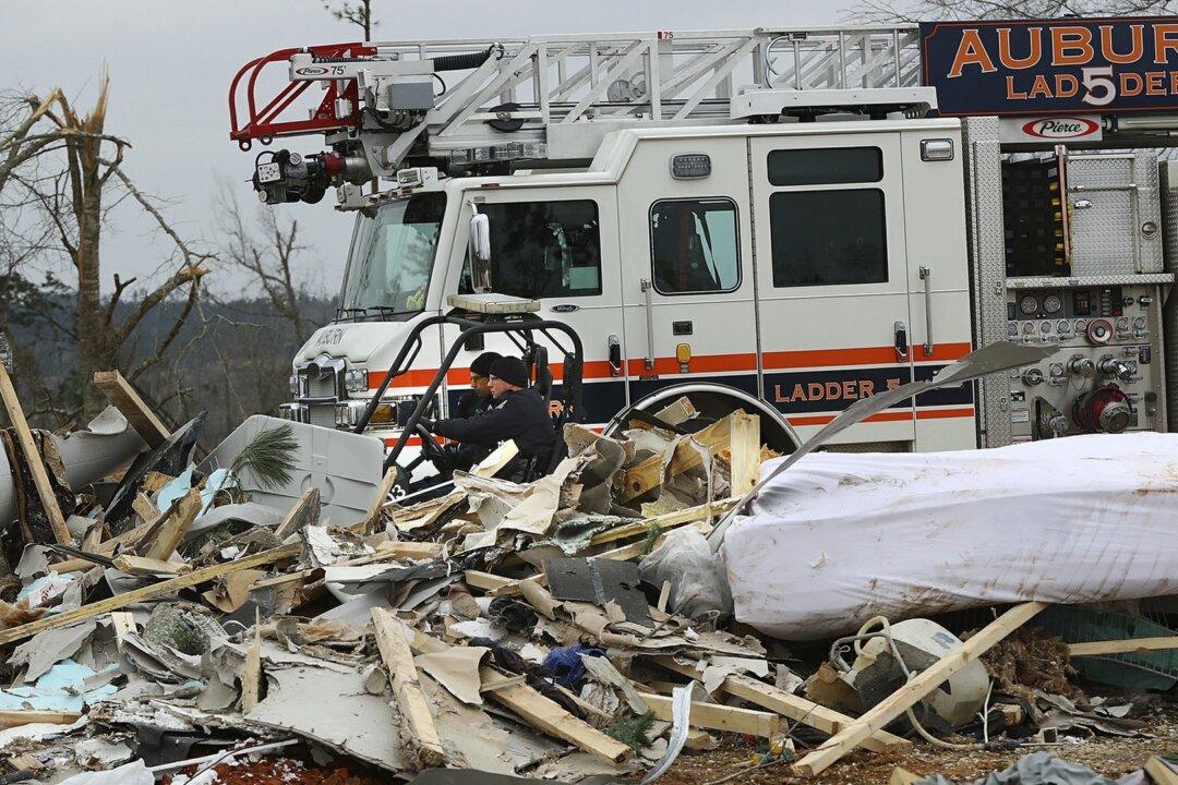 Rescue Crew Using Dogs and Drones to Look for Victims of Tornado That Killed 23