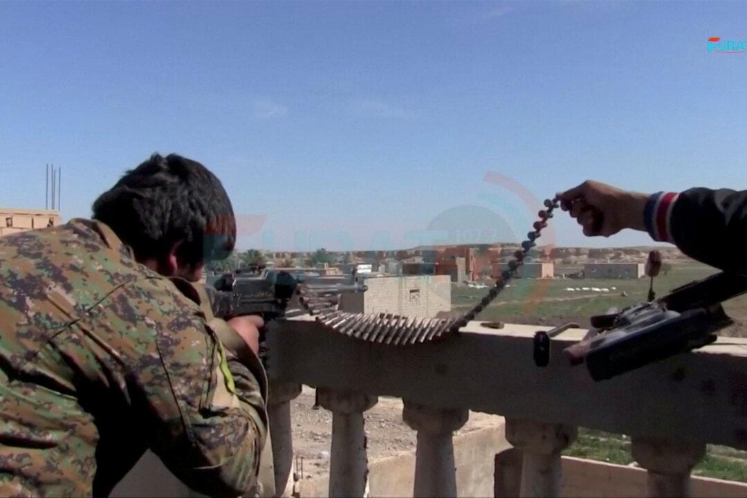 Hundreds of ISIS fighters surrender in east Syria