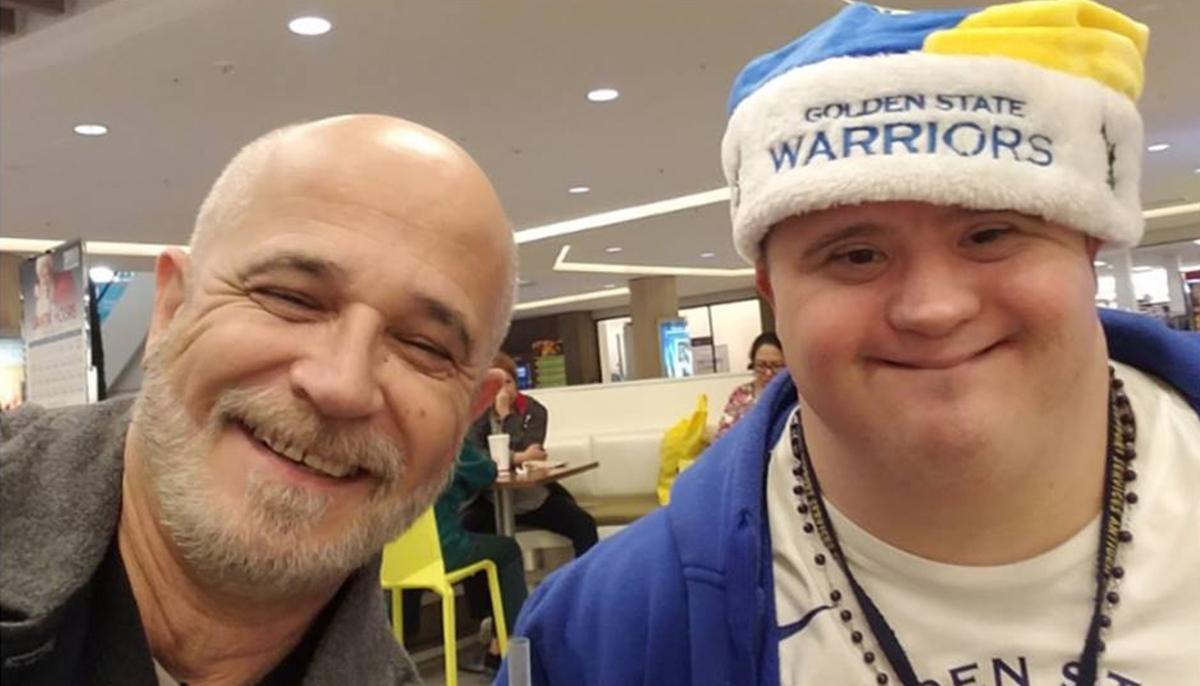 Son with Down Syndrome Gets Down on Knees to Comfort Dad Through a Difficult Moment