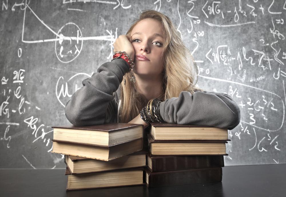Illustration - Shutterstock | <a href="https://www.shutterstock.com/image-photo/thinking-girl-background-blackboard-maths-112224851">Ollyy</a>