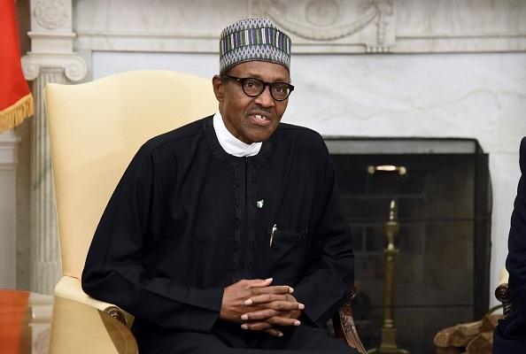 Nigerian President Muhammadu Buhari speaks during a meeting with US President Donald Trump in the Oval Office of the White House in Washington, on April 30, 2018. (Olivier Douliery-Pool/Getty Images)