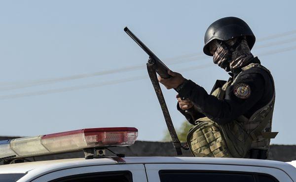 National Police members patrol the city during the massive blackout that has paralyzed Venezuela for days, in Maracaibo, in the border state of Zulia on March 13, 2019. (Juan Barreto/AFP/Getty Images)