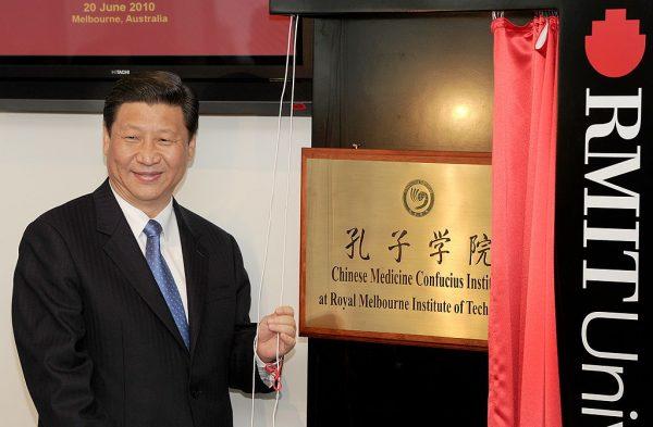 China's then-Vice President (now Chinese leader) Xi Jinping unveils a plaque at the opening of Australia's first Chinese Medicine Confucius Institute at the RMIT University in Melbourne on June 20, 2010. (William West/AFP/Getty Images)