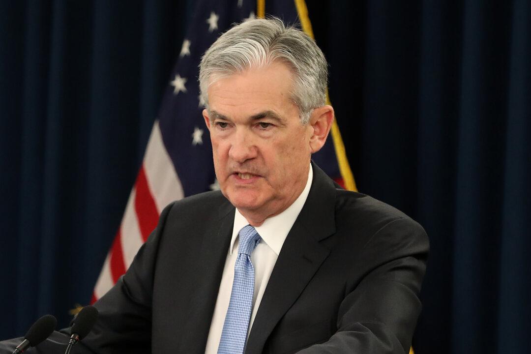Fed Sees No Rate Hikes in 2019, Plans to Slow Balance Sheet Reduction