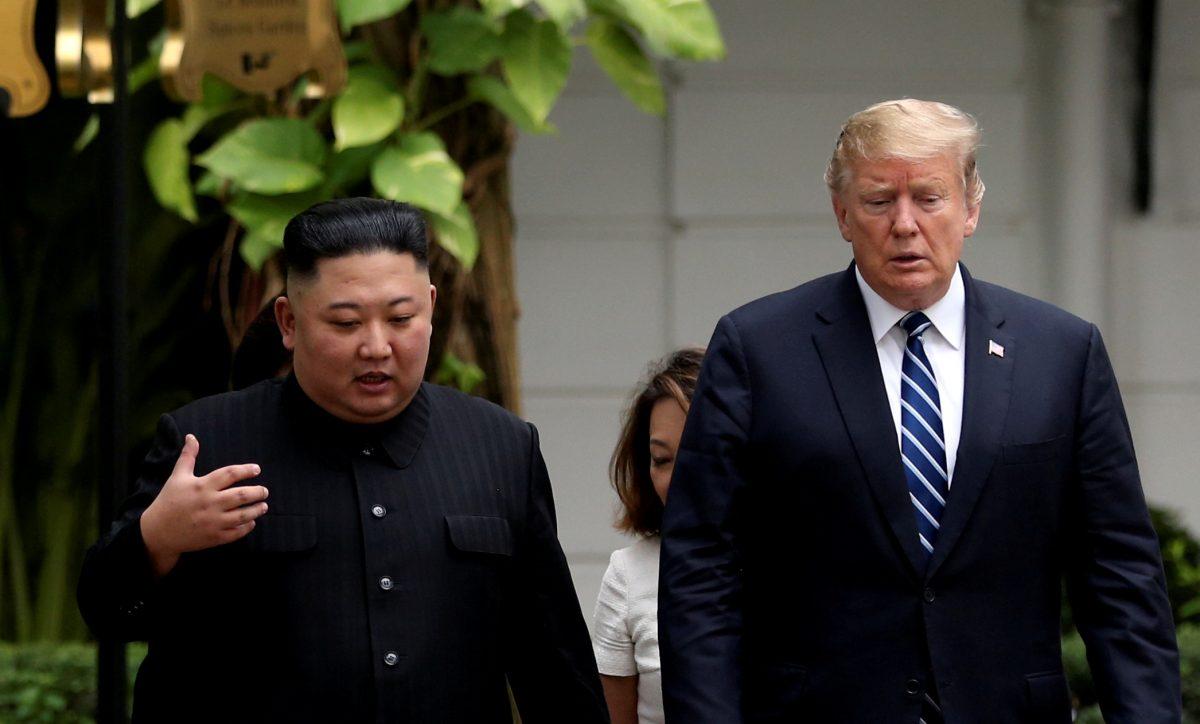 North Korea's leader Kim Jong Un and U.S. President Donald Trump talk in the garden of the Metropole hotel during the second North Korea-U.S. summit in Hanoi, Vietnam, on Feb. 28, 2019. (Leah Millis/Reuters)