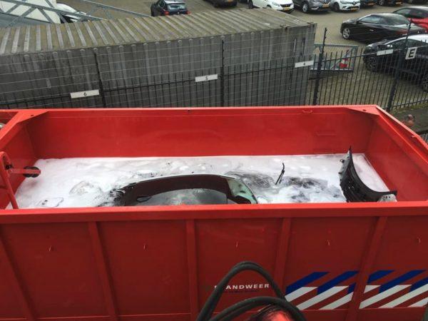 The smoking BMW i8 was left submerged for around 24 hours, in Brabant province, Netherlands, on March 25, 2019. (Brandweer Midden- en West-Brabant)
