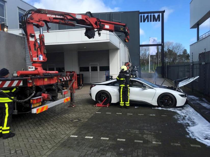 Firefighters Dunk Smoking BMW Hybrid Electric Vehicle in Huge Vat to Put It Out