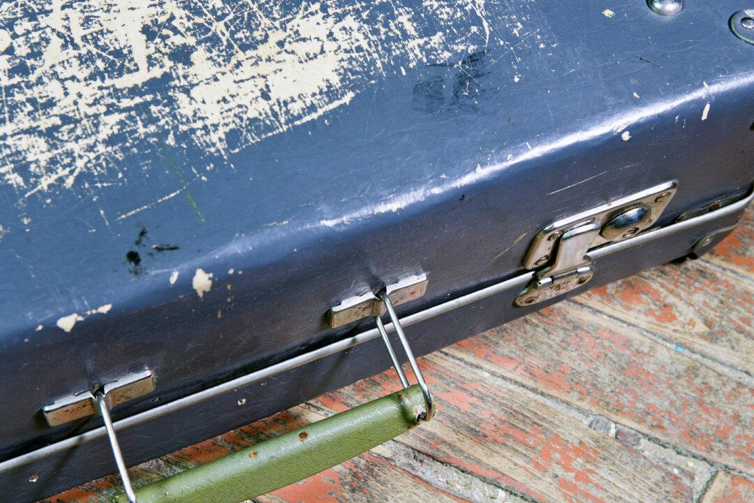 Couple Stumble on 1950s Suitcase Full of Cash Hidden in a Wall While Renovating Basement