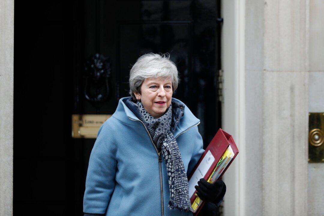 British PM Theresa May Says She Will Quit If Her Brexit Deal Passes