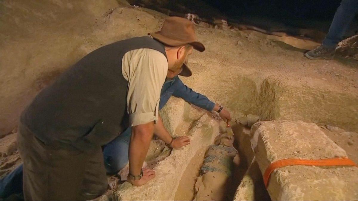Archaeologists are observing a mummy in Minya, Egypt, on April 8, 2019. (Discovery Channel via Reuters)