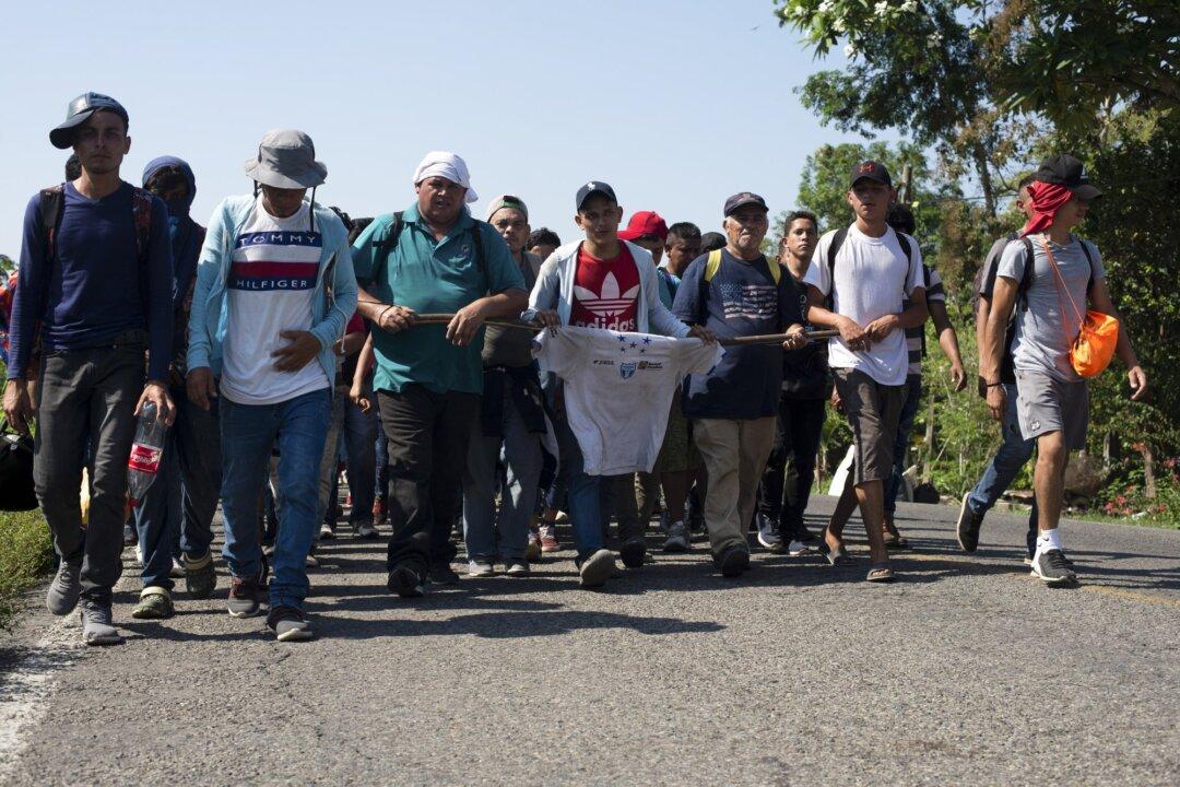 Illegal Immigrants Break Border Gate, Force Their Way Into Mexico
