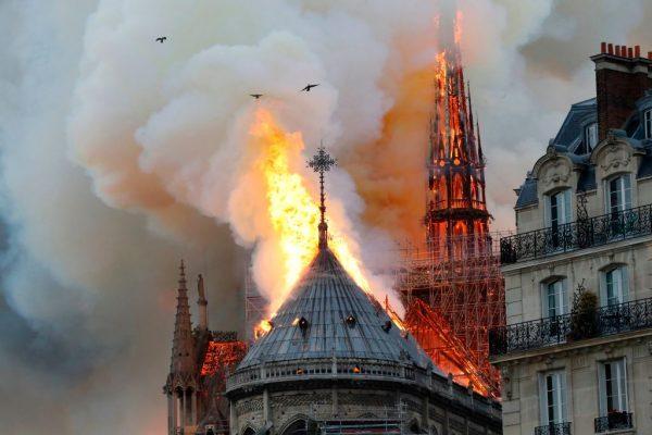Smoke and flames rise during a fire at the landmark Notre Dame cathedral in central Paris on April 15, 2019, potentially involving renovation work being carried out at the site, the fire service said. (Francois Guillot / AFP/Getty Images)