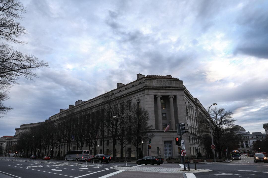 Watchdog Sues Justice Department for FBI Contacts With Democratic Law Firm