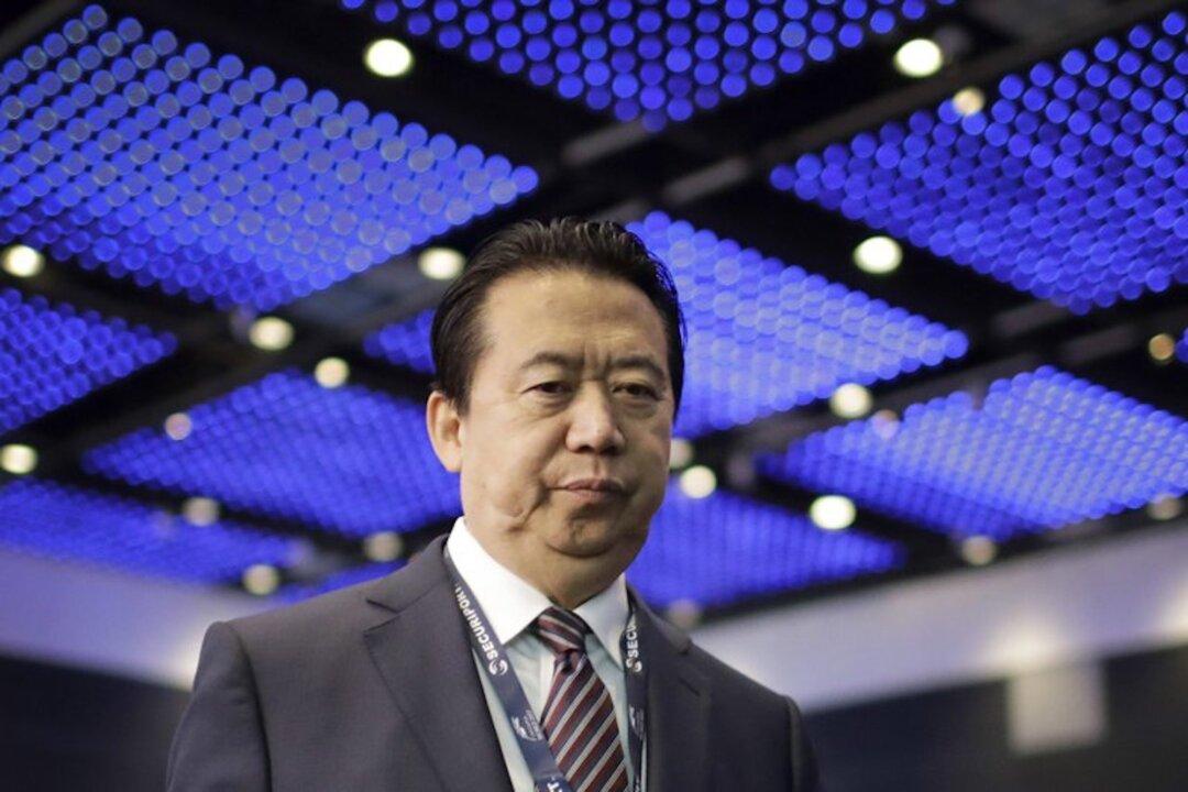 China Sentences Former Interpol Chief to 13 Years for Accepting Bribes