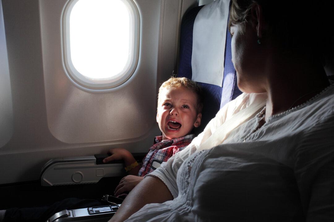 Mom Tears Up When Cranky Kids Annoy Passengers on Plane, So Flight Crew Hands Her a Note