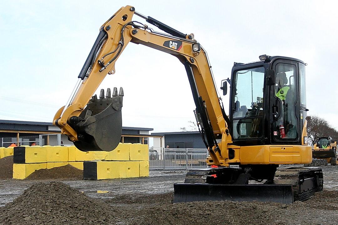 Father Leads 3-Year-Old Boy to Drive Construction Vehicle on Public Road