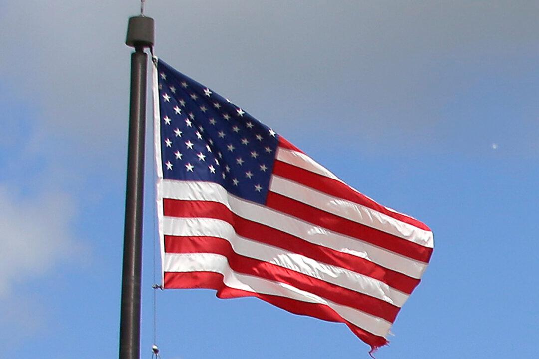 Lone Man Stands in Pouring Rain to Salute Fallen Soldier’s Funeral Procession