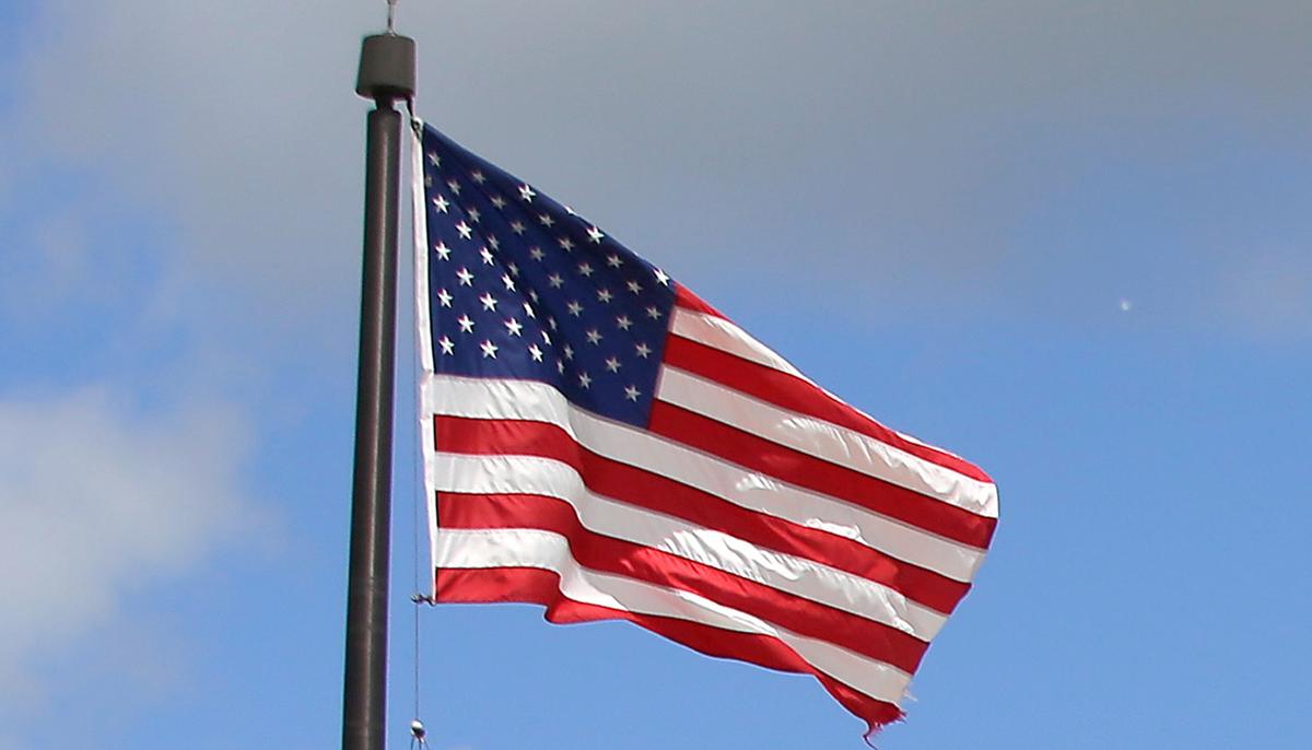 Lone Man Stands in Pouring Rain to Salute Fallen Soldier’s Funeral Procession