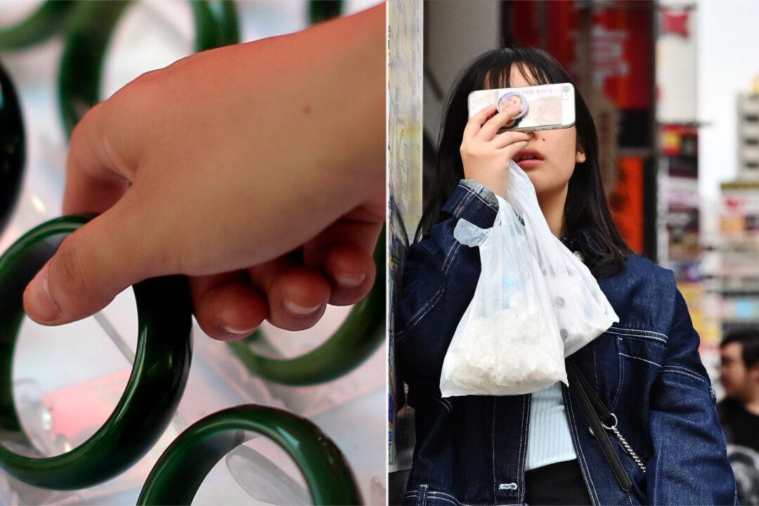 Woman Using Smartphone Walks Into Glass Wall, Breaks Family Heirloom, Demands Compensation