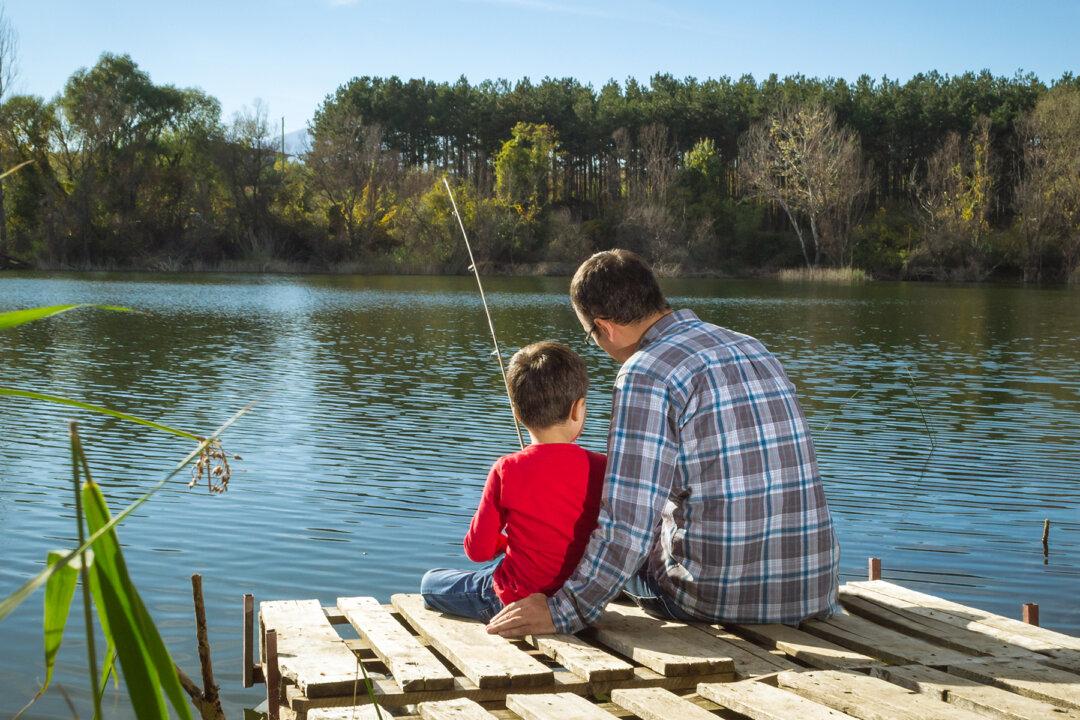 Passerby Sees Dad and Son Fishing at Lake. Moments Later, Father Jumps Right Into Water