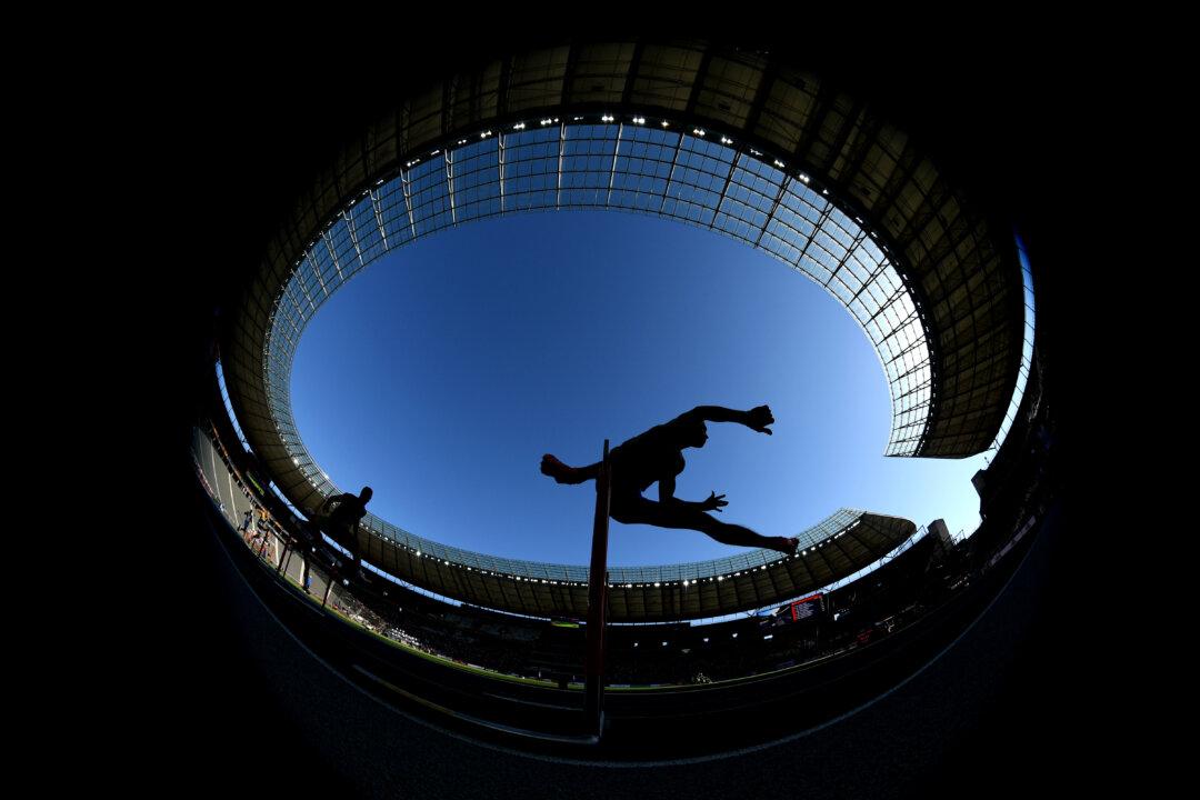 College Hurdler Goes the ‘Full Superman’ to Clinch Title
