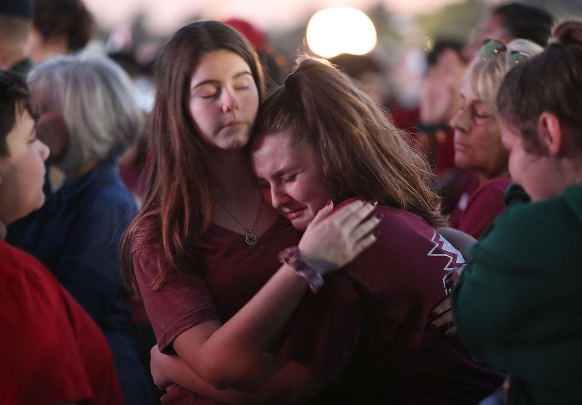 People attend a memorial service at Pine Trails Park, Parkland, Florida, on Feb. 14, 2019. 14 students and three staff members were killed during the mass shooting at Marjory Stoneman Douglas High School on Feb. 14, 2018. (Joe Raedle/Getty Images)