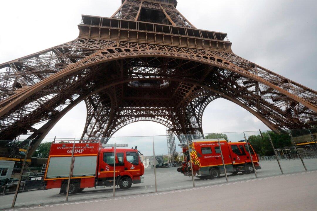 Eiffel Tower Evacuated as Man Seen Climbing the Landmark