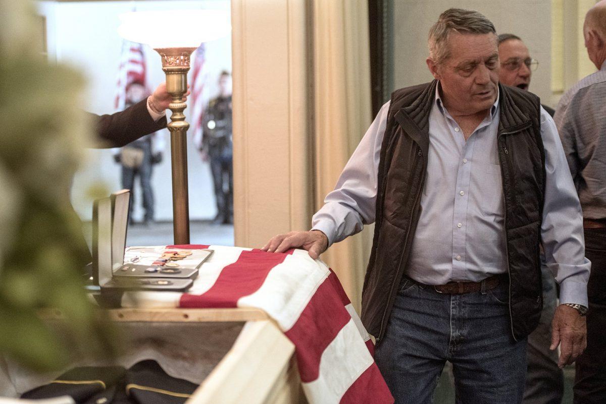 Pvt. William A. Boegli's oldest nephew, Don McHenry, pays his respects to Boegli during a funeral service at Dokken-Nelson Funeral in Bozeman, Mont., on May 25, 2019. (Rachel Leathe/Bozeman Daily Chronicle via AP)