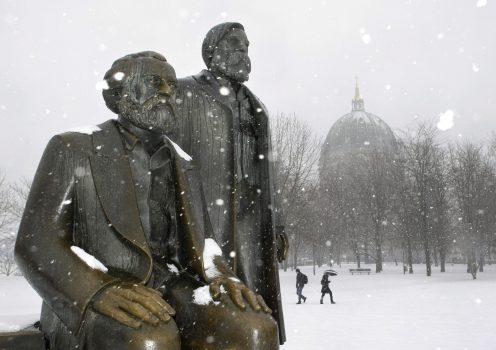 Statues of Karl Marx and Friedrich Engels in Berlin, Germany. In the 170 years since the publication of “The Communist Manifesto,” governments around the globe have been openly or covertly influenced by Marxist theories. (Herbert Knosowski/AP Photo)