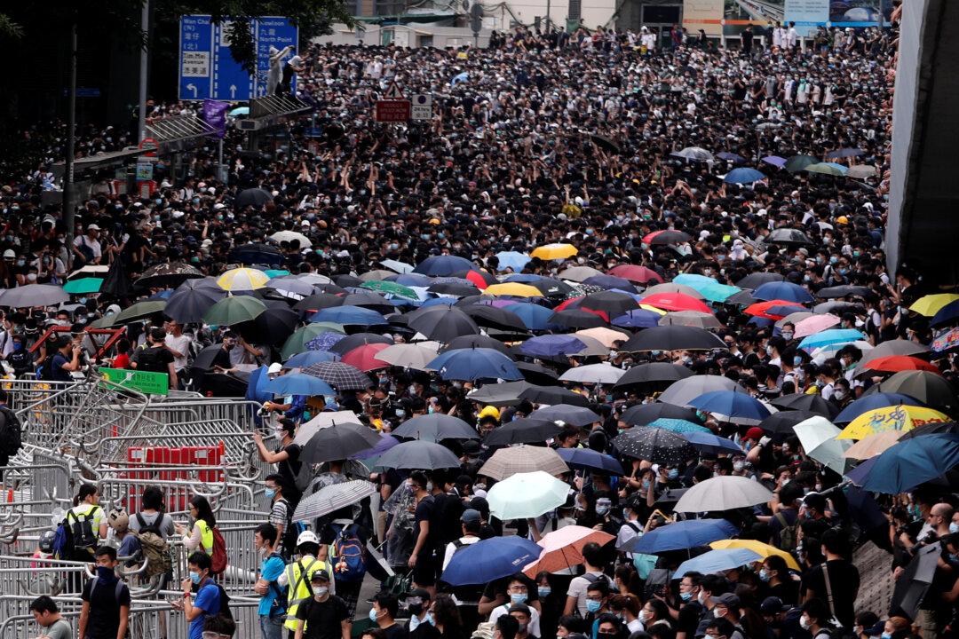 Thousands of Protesters Paralyze Hong Kong’s Financial Hub Over Extradition Bill