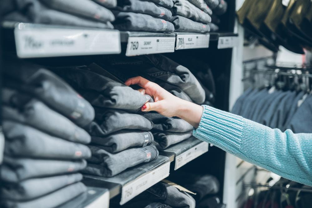 ©Shutterstock | <a href="https://www.shutterstock.com/image-photo/jeans-store-shopping-shelf-new-grey-1055224280?src=7ziEzkdb8KzBf8zAwnHJSA-1-67&studio=1">Vera Petrunina</a>