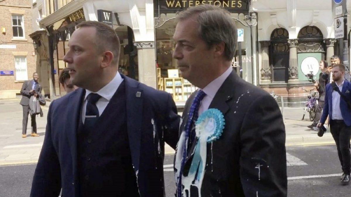 Brexit Party leader Nigel Farage after being hit with a milkshake during a campaign walkabout for the upcoming European elections in Newcastle, England, on May 20, 2019. (Tom Wilkinson/PA via AP)