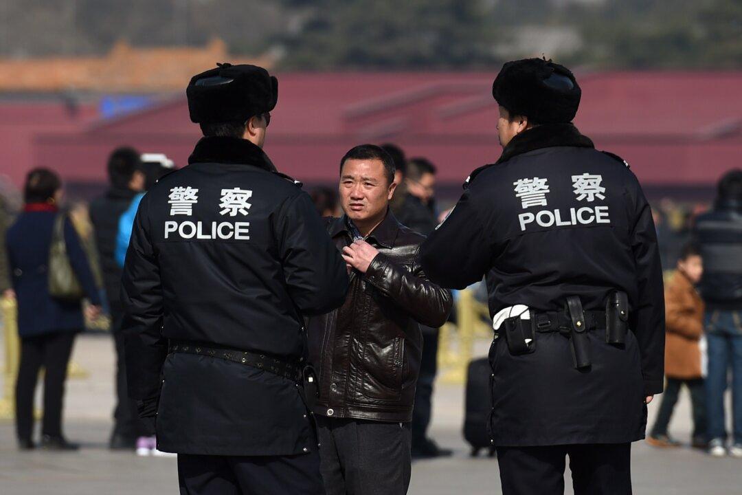 Chinese Police Step Up Phone Checks, Using Surveillance Apps