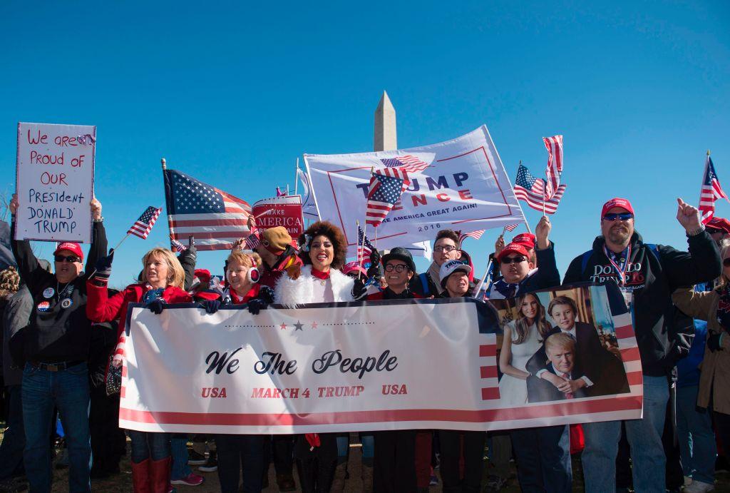 Singer Joy Villa (C) and designer Andre Soriano take part in a pro-Trump rally outside the Washington Monument on March 4, 2017, in Washington. (MOLLY RILEY/AFP/Getty Images)